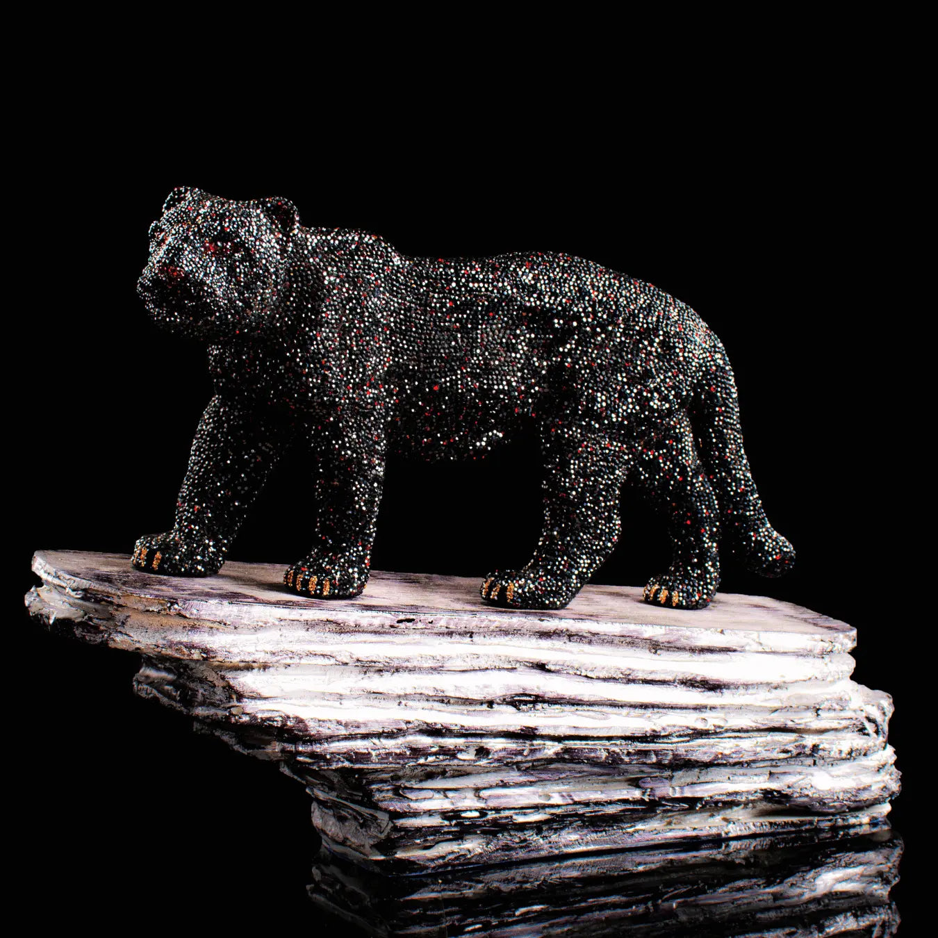 Black panther sculpture handcrafted with 30,000 black and red Asfour crystals, 24K gold-plated claws and accents, by Asfour Crystal.